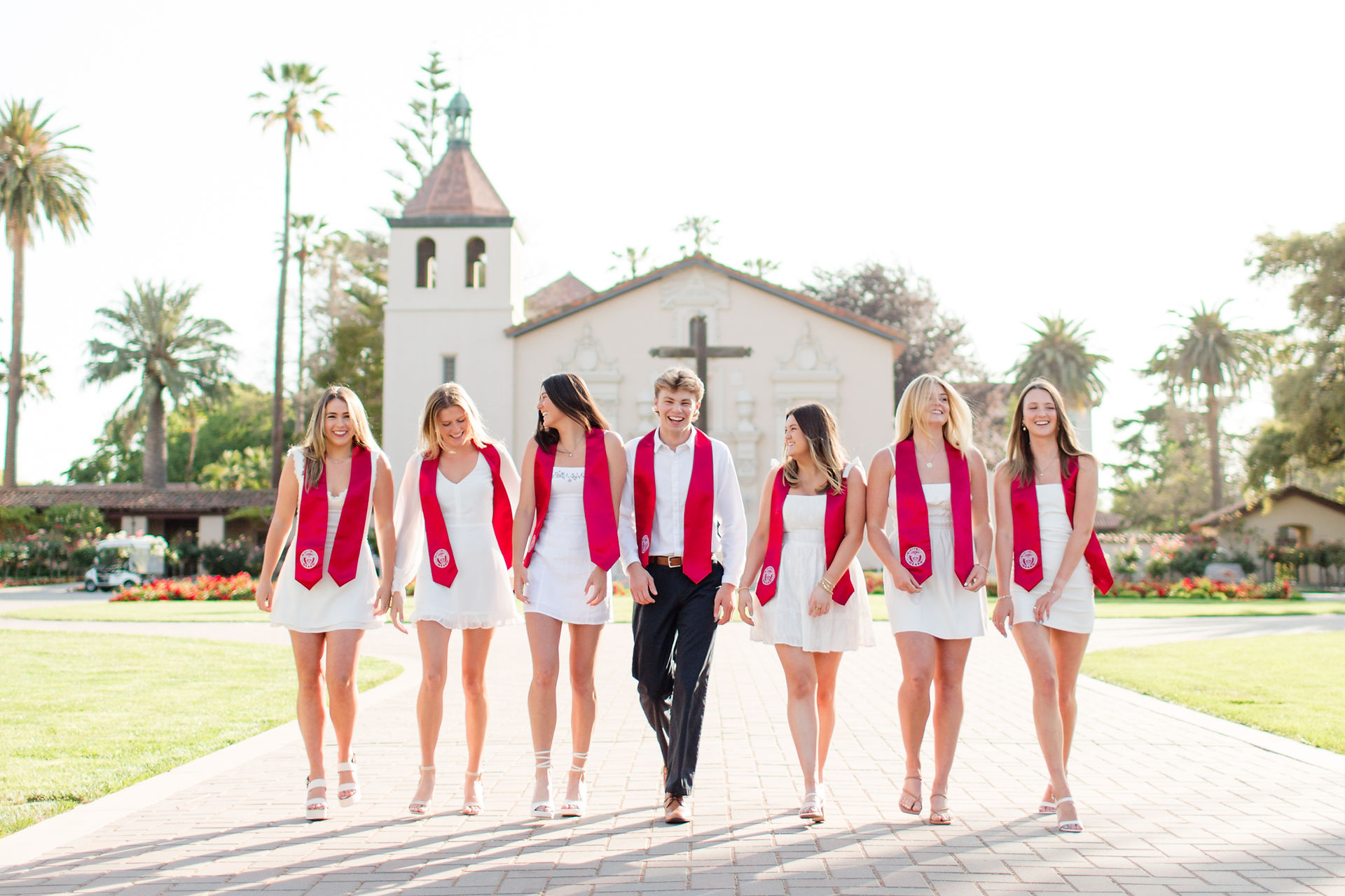 santa clara university california group grad photo session walking near mission at scu campus