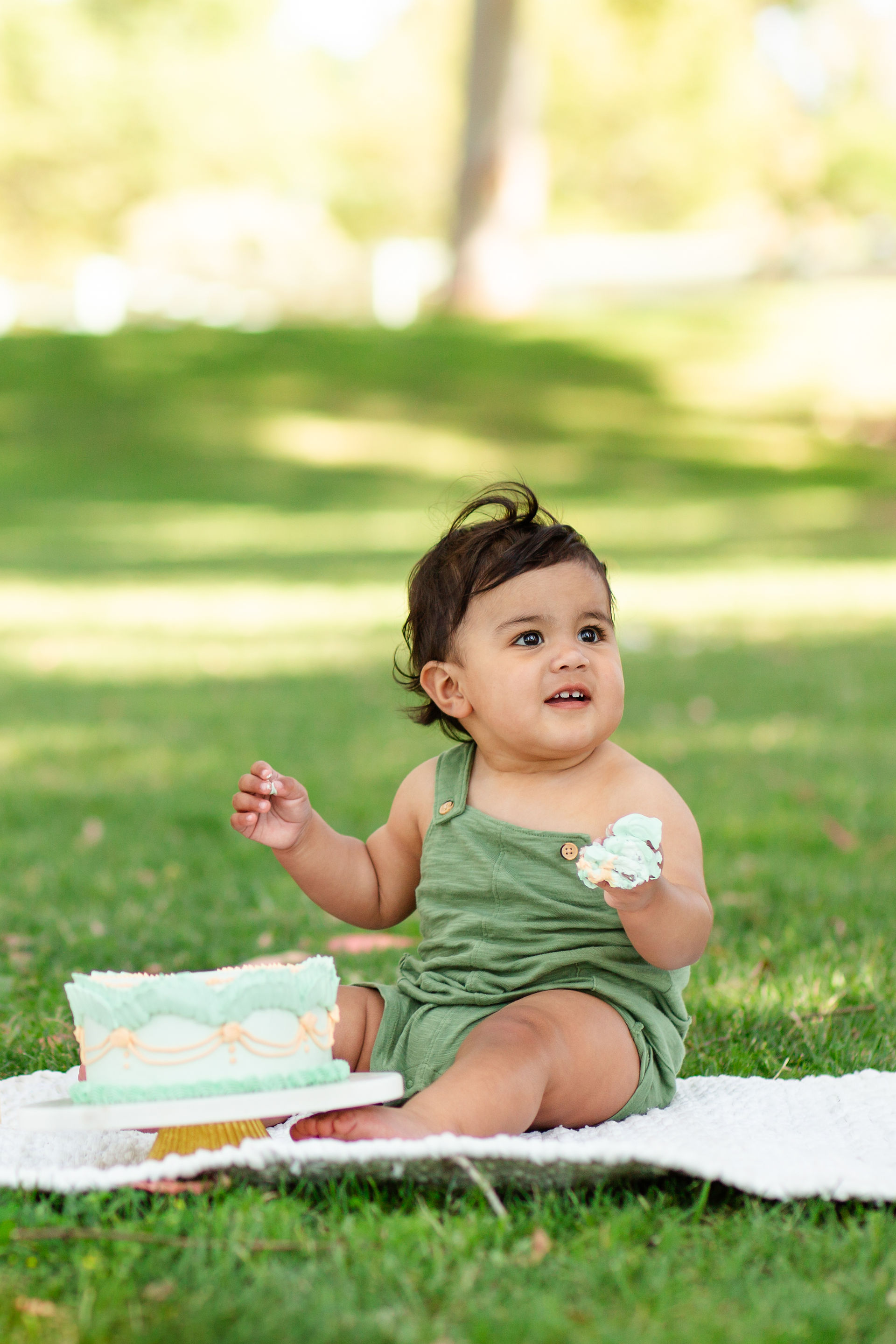 hkcreate bay area photography natural light photographers san jose photographers baylands park sunnyvale baby's first cake smash corduroy themed cake smash cute happy little boy green overalls mint cake light and airy photography joyful candid creative