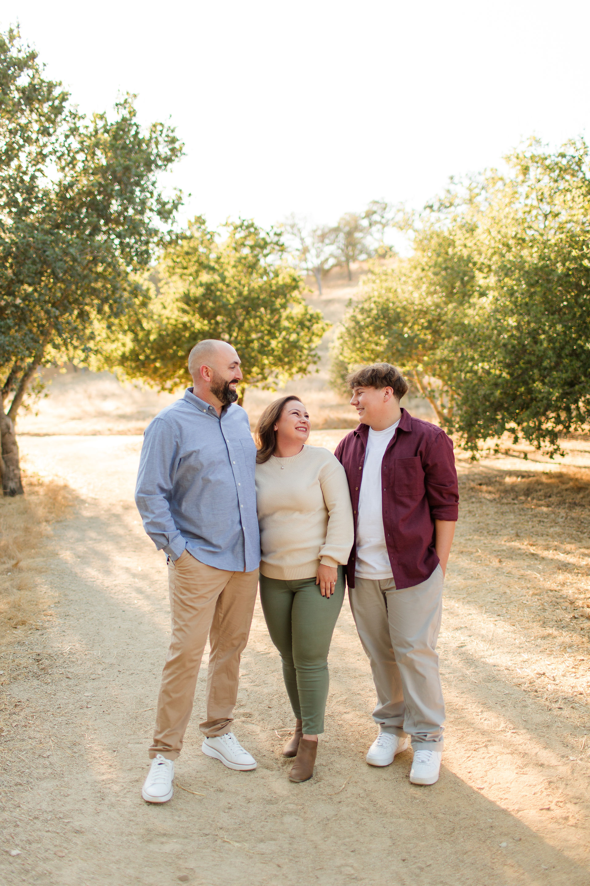 hkcreate hk create bay area photographers family of three photo session fall mini teen son joyful candid happy golden hour light and airy guadalupe oak grove park san jose
