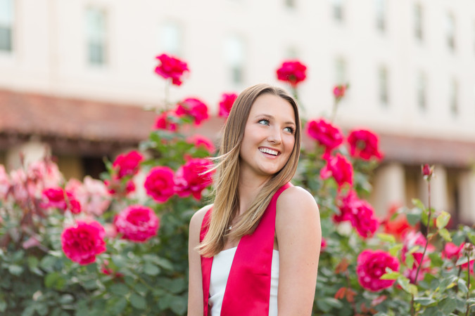 santa clara university group grad portraits in front of roses