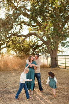 Coyote Lake Harvey Bear County Park photoshoot family location bay area photography hkcreate morgan hill mini session family of four playful fun joyful sunset emerald dress neutral outfits family of four fun playful candid posing ideas