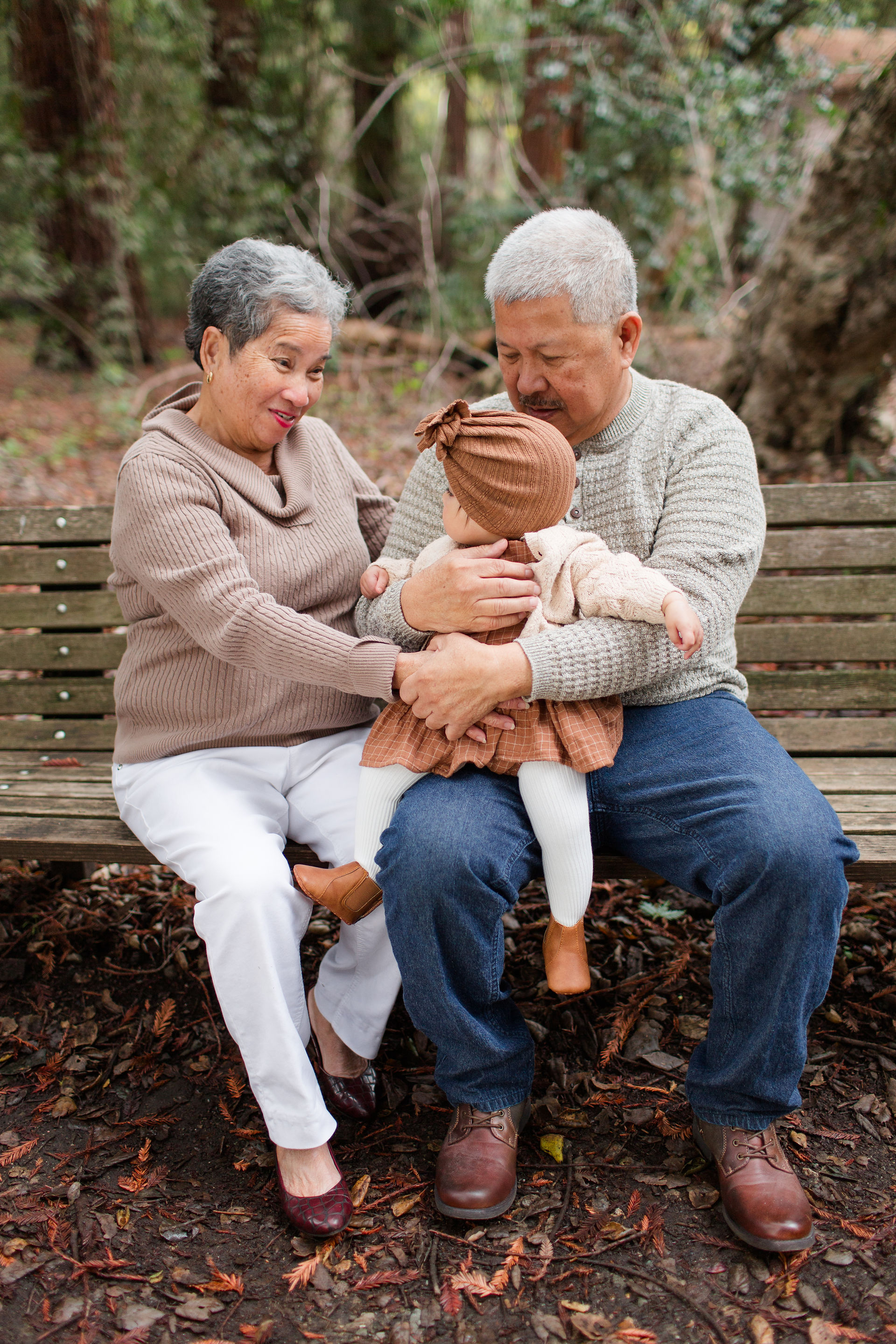 hkcreate bay area photography joyful light and airy san jose photographers northern california photoshoot legacy extended family neutral outfit ideas sweaters baby girl and grandparents sitting bench