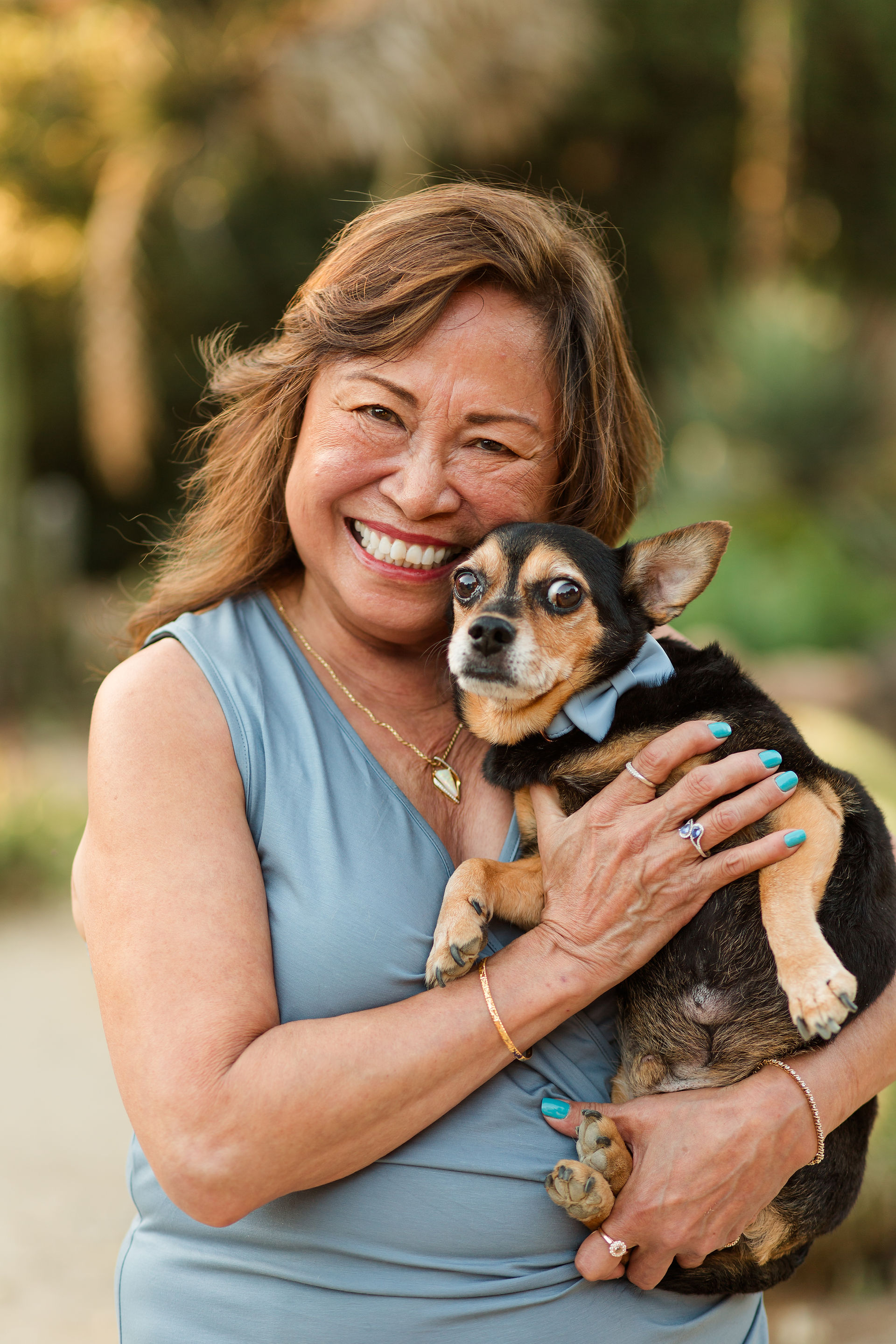 hkcreate bay area photography san jose photographers arizona cactus garden stanford palo alto family legacy session photoshoot joyful happy laughter laughing rust blue and sage color scheme golden hour ohana light and airy summer mom holding dog