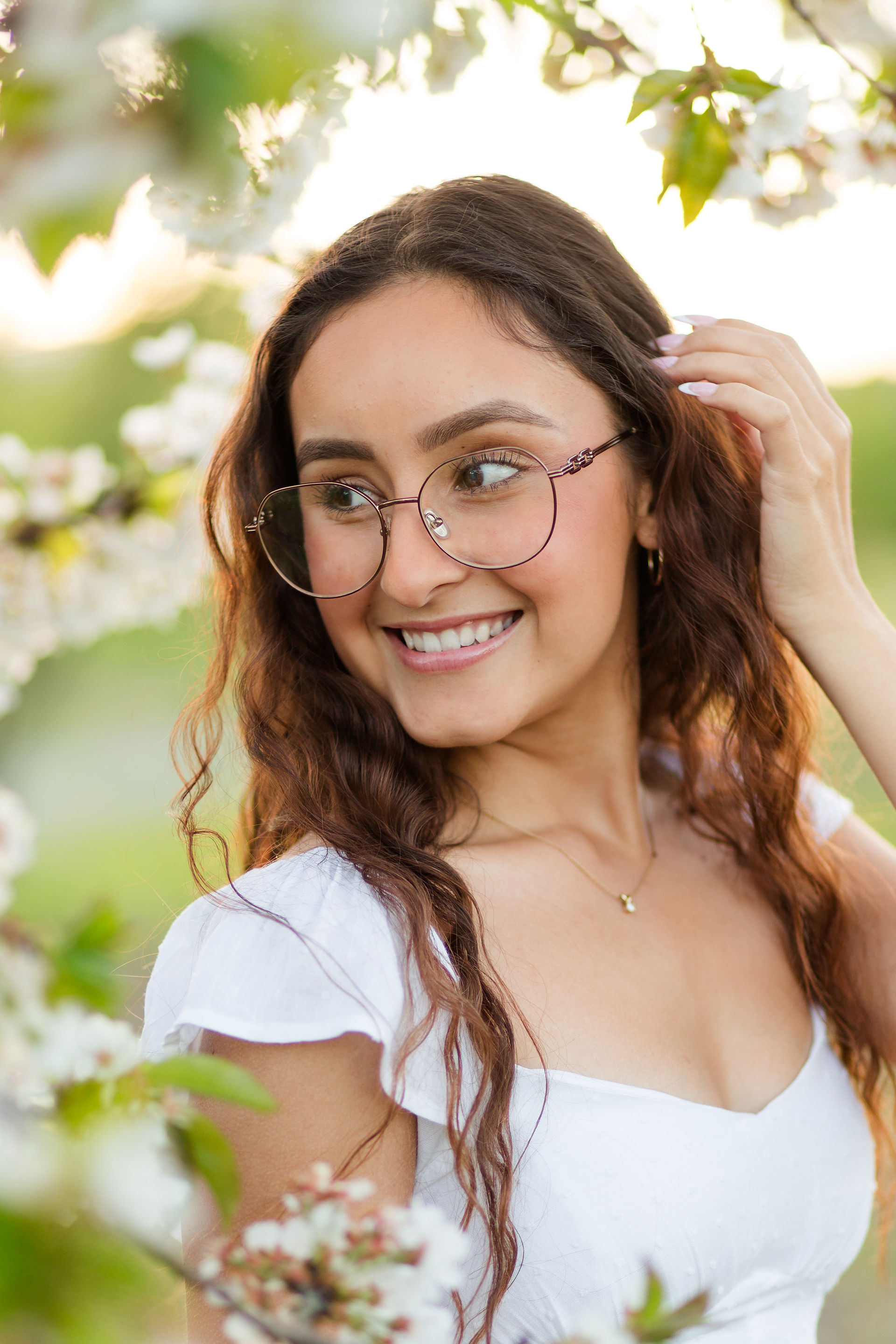 hkcreate bay area photography san jose photographers heritage orchard saratoga library high school graduation photoshoot beautiful golden hour graceful bloom session with flowers whimsical joyful happy light and airy northern california casual outfit white dress mustard yellow flowers portrait tall grass