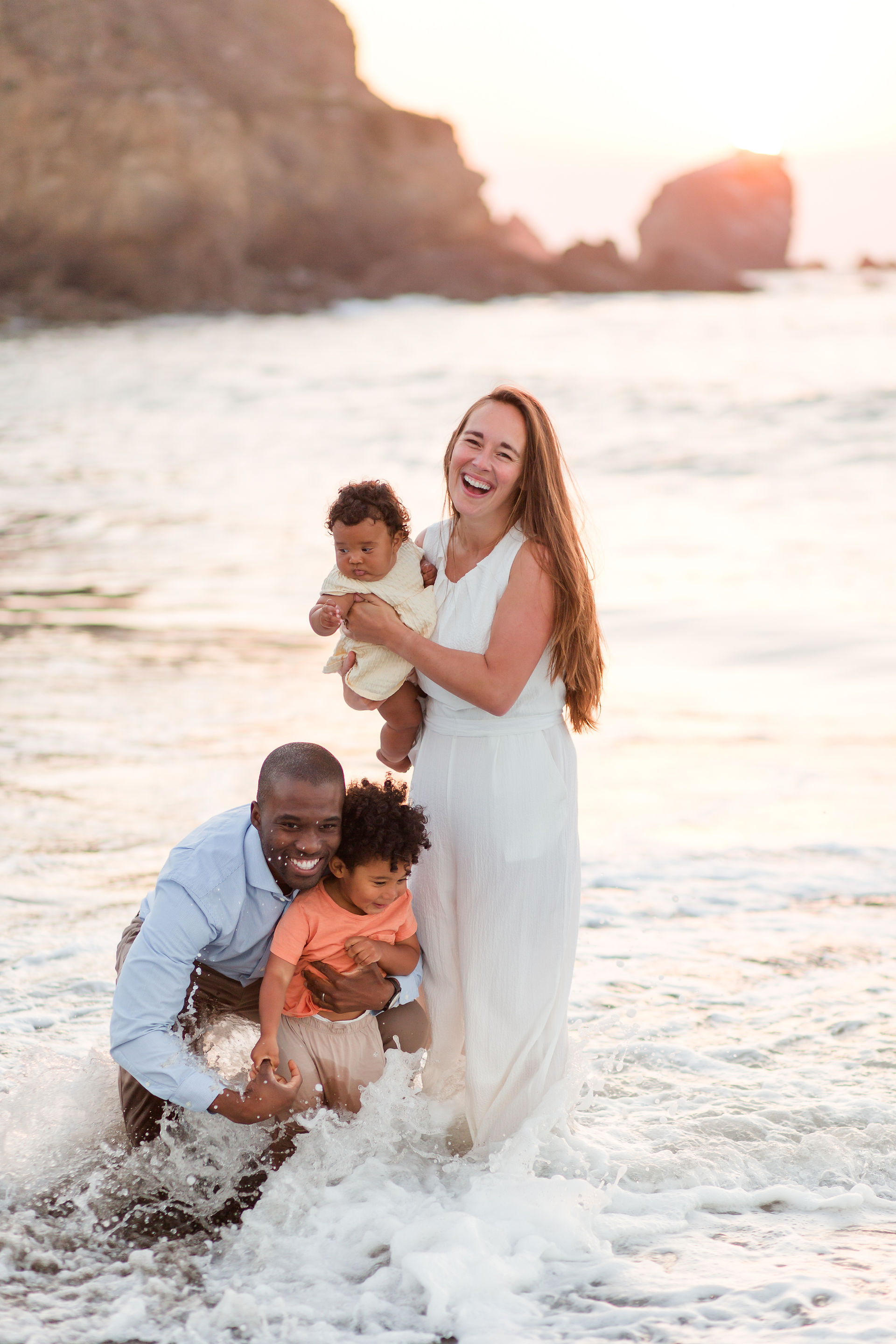 hk create photography beach photoshoot biracial family ethnic little kids playing in the ocean laughing rockaway beach pacifica