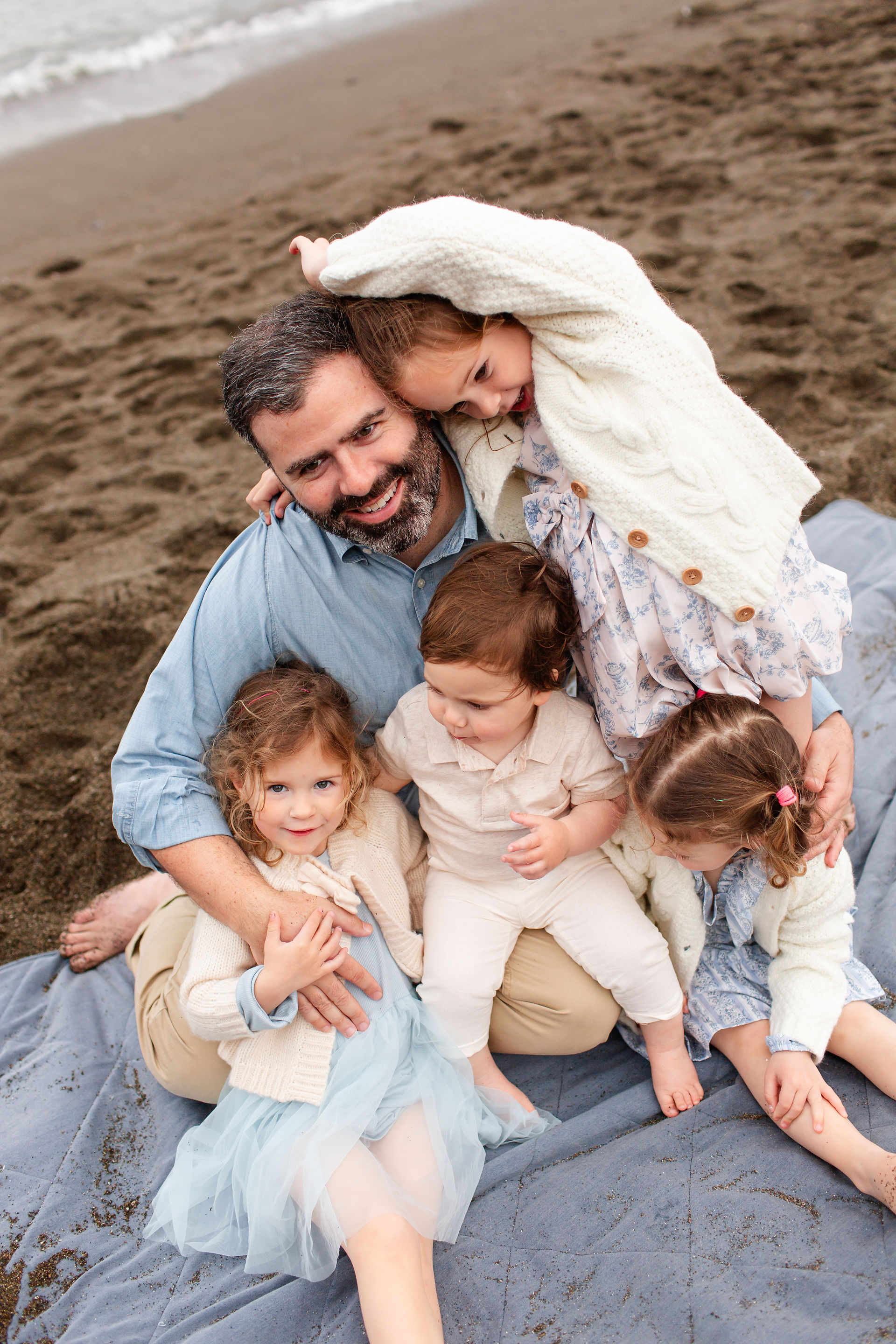 Overcast Beach Family Photoshoot at Rockaway Beach in Pacifica by Bay Area Photographers HKCreate Dad with four kids
