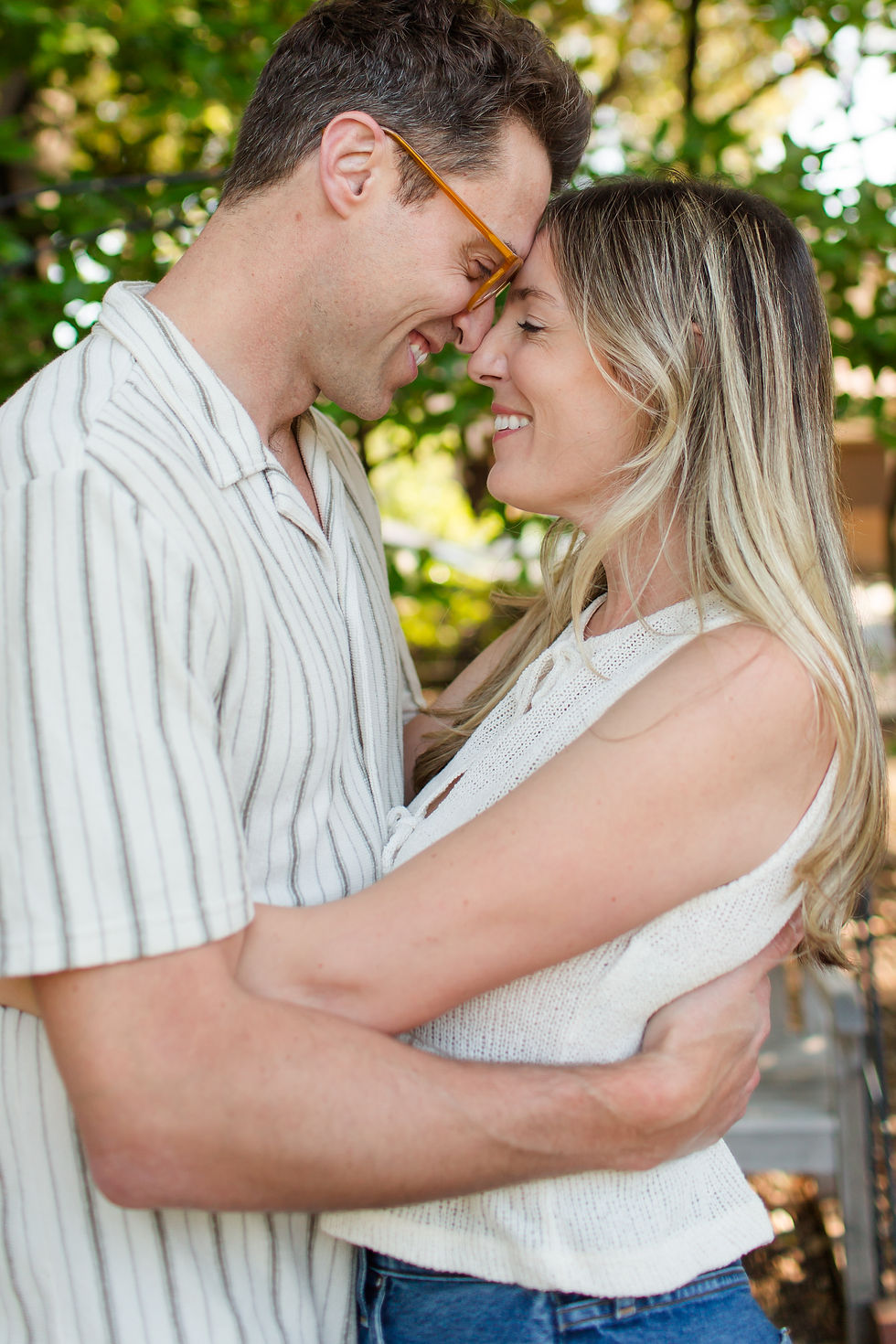 Smiling couple embrace forehead to forehead outdoors, with soft green trees behind them, creating a warm, loving mood.
Spring Family Photoshoot at Elizabeth Gamble Garden, Palo Alto by Bay Area Photographers HKCreate
