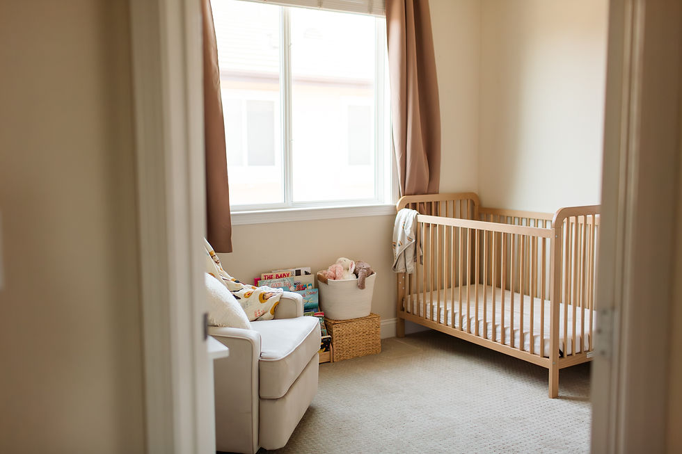 Cozy nursery with a wooden crib, white chair, books, and a toy basket by a bright window; book text reads THE BABY.
Lifestyle Newborn Family Photoshoot in San Jose California by Bay Area Photographers HKCreate
