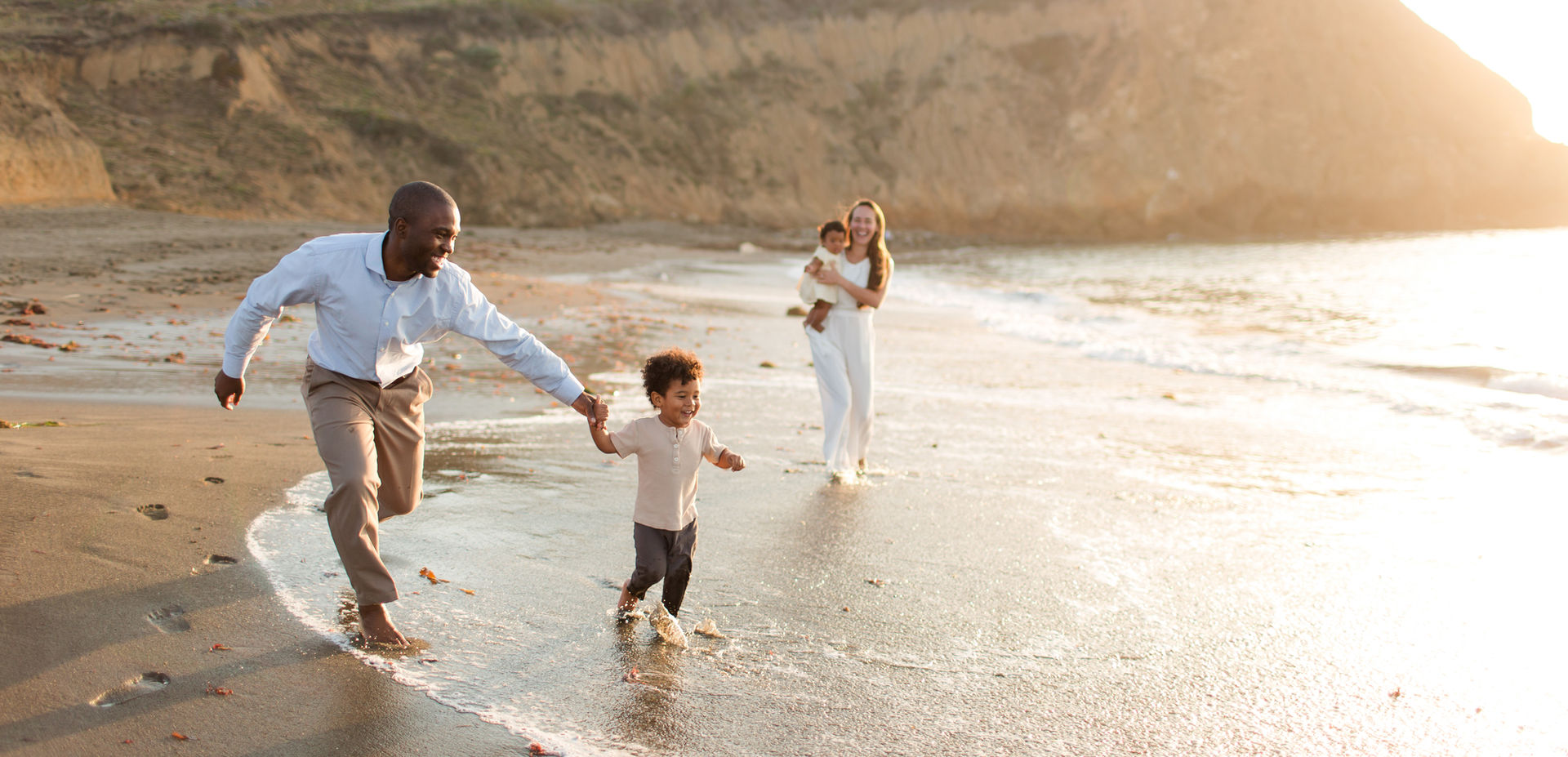 hk create bay area photography beach family running in the waves baby toddler laughing