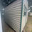Thumbnail: Pre-owned 10 x 10 Garden Shed with 10 ft Shelf, Workbench, and Electric 26333
