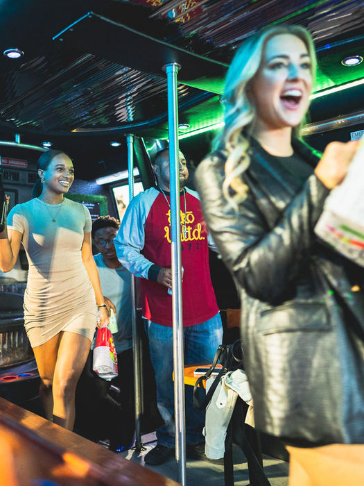 Group of friends inside a party bus celebrating a bachelorette party in Scottsdale