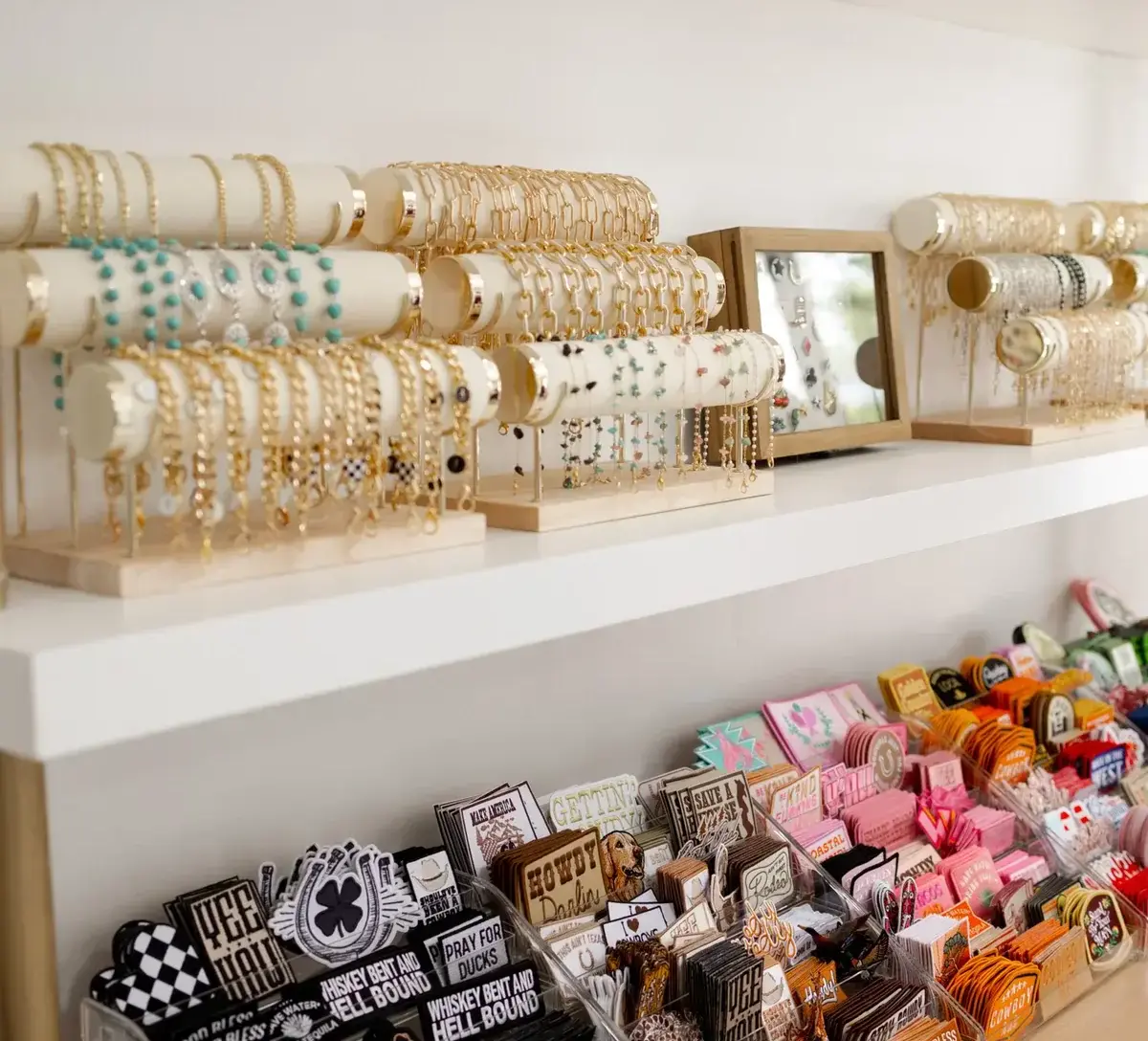 Jewelry display with bracelets, hats, and patches