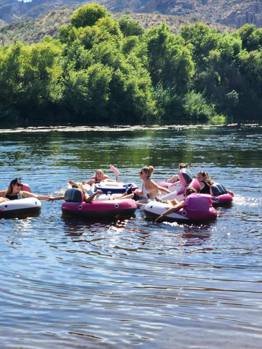 Group of friends tubing down the Salt River in Scottsdale