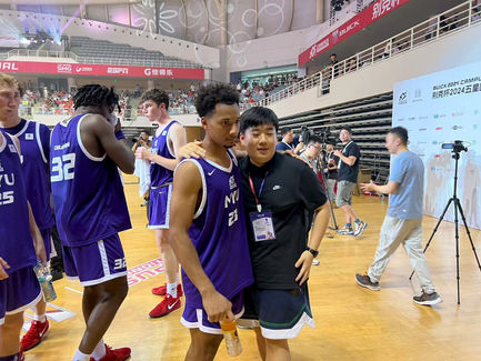 Photo with Men Basketball team members of NYU 4