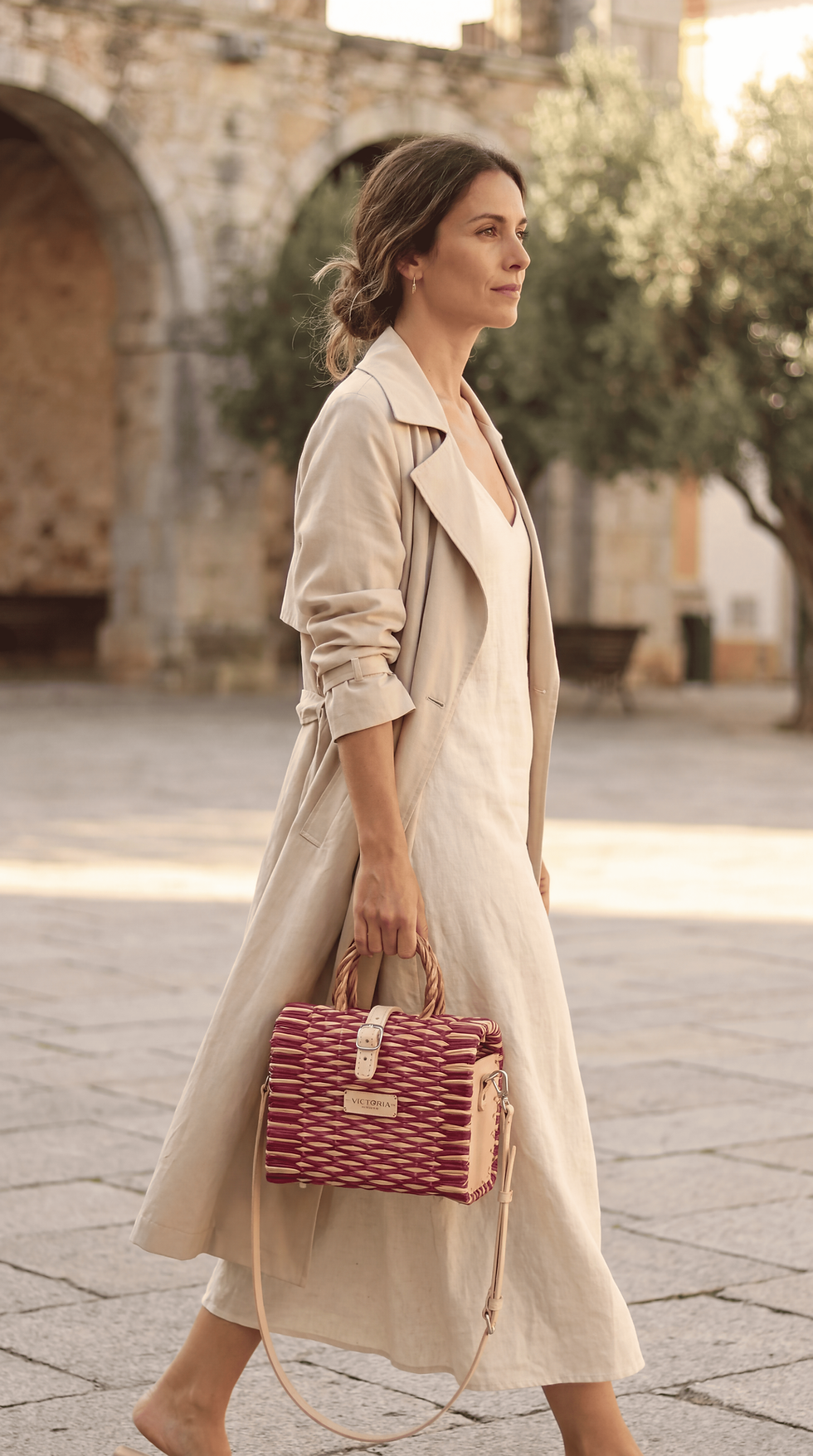 a handcrafted mini basket made of natural woven reed in soft blush pink tones,