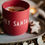 Miniaturbild: Becher "HEY SANTA"