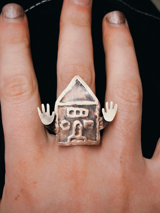 Close up of hand wearing ring