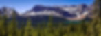 Snow-capped mountains and Crowfoot Glacier under blue sky, green trees in foreground, and a turquoise Bow Lake in the Bow Valley, creating a serene landscape.