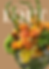Creative floral arrangement with orange flowers, text LOFT by Singapore florist