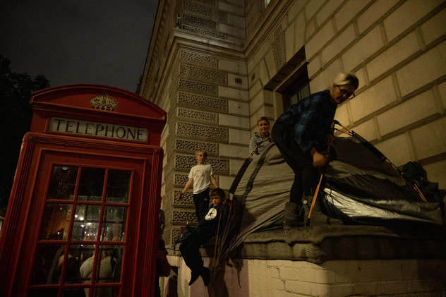 18th September 2022 | A family sets up tents to spend the night before the Queen's funeral in Parliament Square.