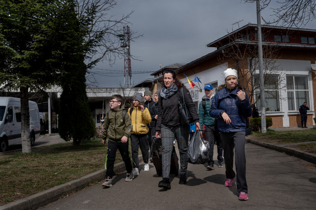 April 2022 | Maria, 35 years old, from Rivne, crosses the Ukrainian-Romenian border with her son Oleksandr, 8, her daughter Yulia, 15 and the teenagers from a special school in Rivne region Mykhaylo K., 17, Oleksandr S., 13, Anton Stasink, 13 and Oleksandra B, 13. Maria is a psychologist defectologist for kids with mental disabilities and she left her husband, her parents and her sister in Ukraine, in order to take the guys to a safer country. 