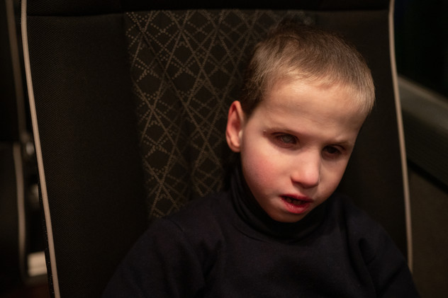 April 2022 | Volodumuz, 8 years old on the coach leaving Siret, Romania, to go to another European country, part of the evacuation program. Adaptation to temporary locations, different food and habits represents a constant challenge.