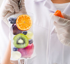 Healthcare worker holding a IV bag