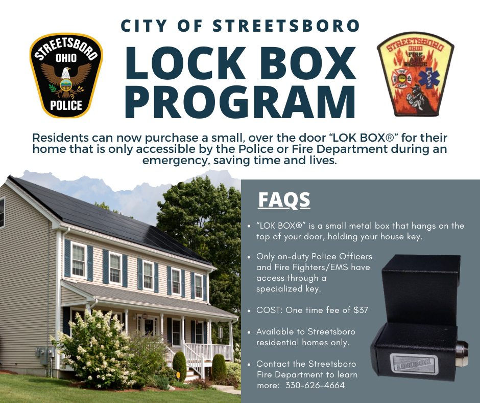 Eye-level view of a residential front door with a mounted lock box beside it