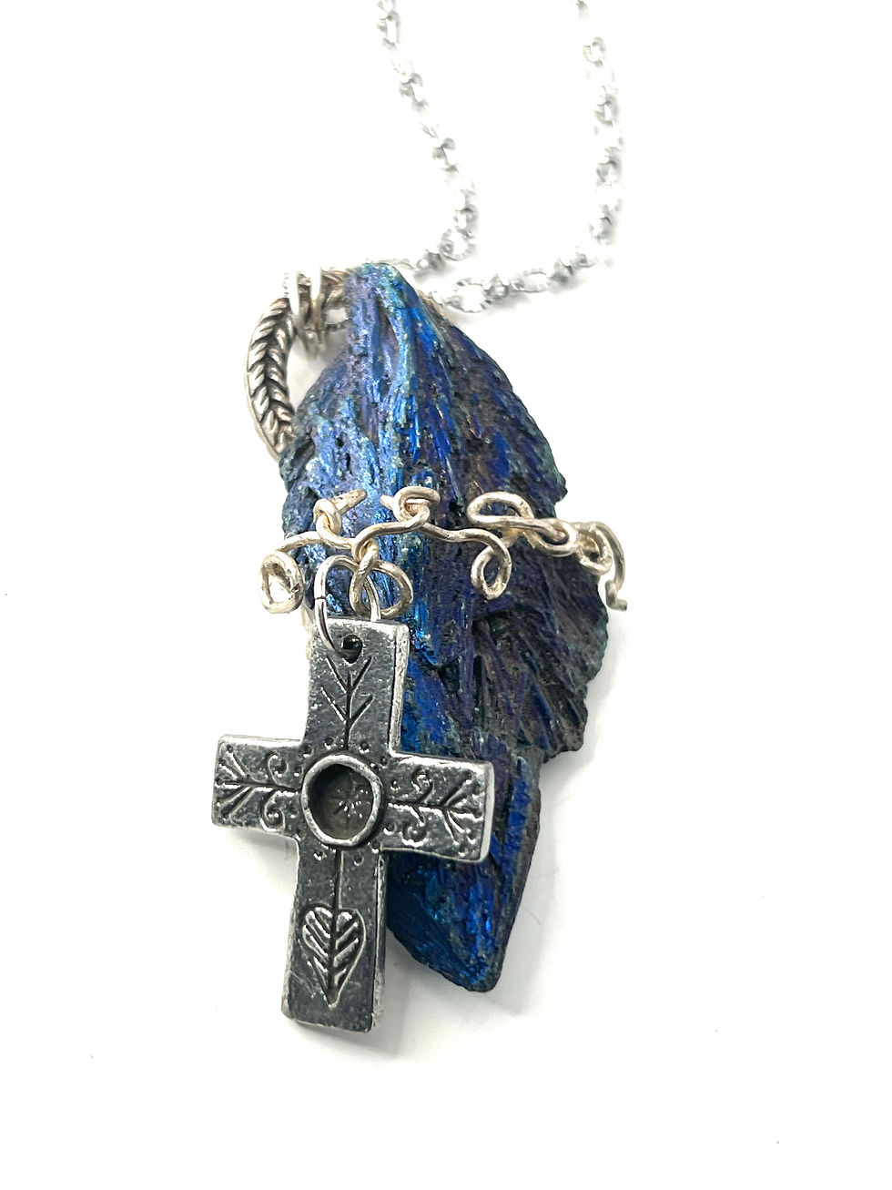Thumbnail: Cross with crown band on a Aura rainbow titanium crystal blue quartz