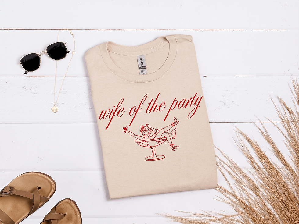 Thumbnail: Beige t-shirt with 'wife of the party' text and martini glass graphic