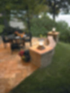 Highland freestanding retaining wall with pillar lights in Rawhide color.