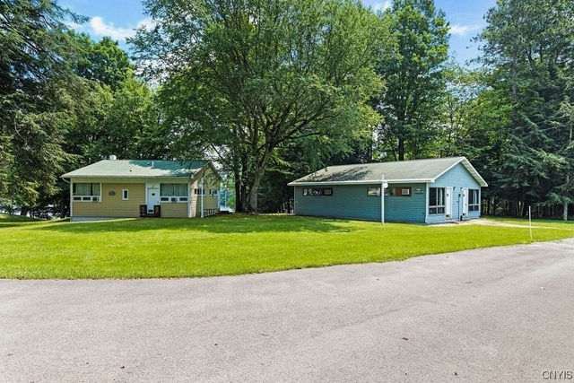 one yellow and one blue cabin on a grassy area