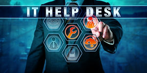 Manager is pressing IT HELP DESK on an interactive touch screen. Information technology co