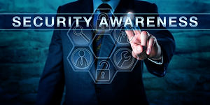 Industry consultant is pressing SECURITY AWARENESS on an interactive touch screen interfac