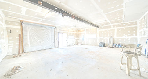 A large room with a lot of white paint o