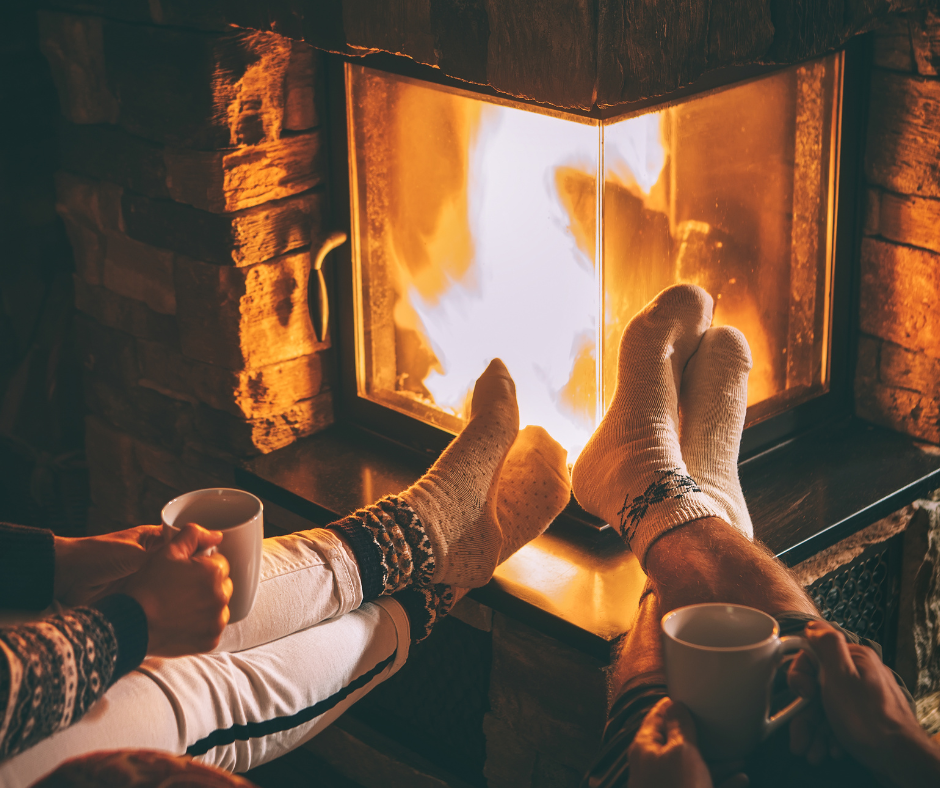 Couple hanging out by the fire in a Duluth winter