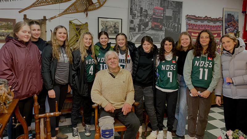 Deni with the NDSS women's lacrosse team, one of the many local groups he's donated to.