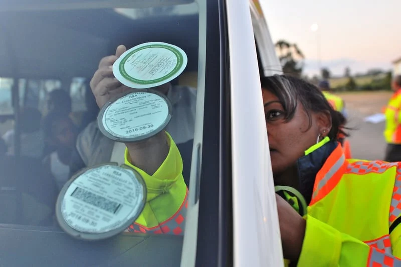 vehicle-car-licence-disc-road-safety-officer-jennifer-solomons-places-sticker-vehicles-win