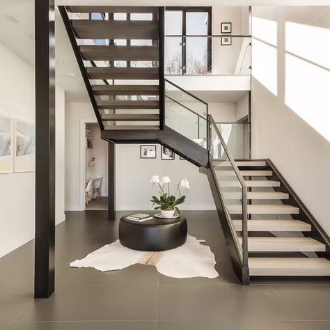 House renovation interior design for Snowmass Village, including modern staircase and large windows. 