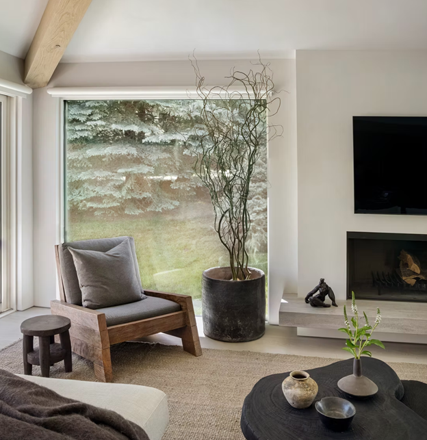 Aspen new interior trends showcasing calming living room with expansive windows to highlight mountain views.