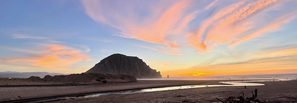Morro Rock and coastline in California at sunset
