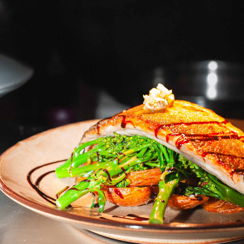 Casa's fresh and delicious fish dish served atop a bed of fresh vegetable