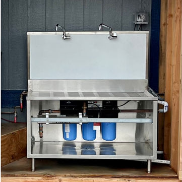 stainless steel water jug filling station at construction site