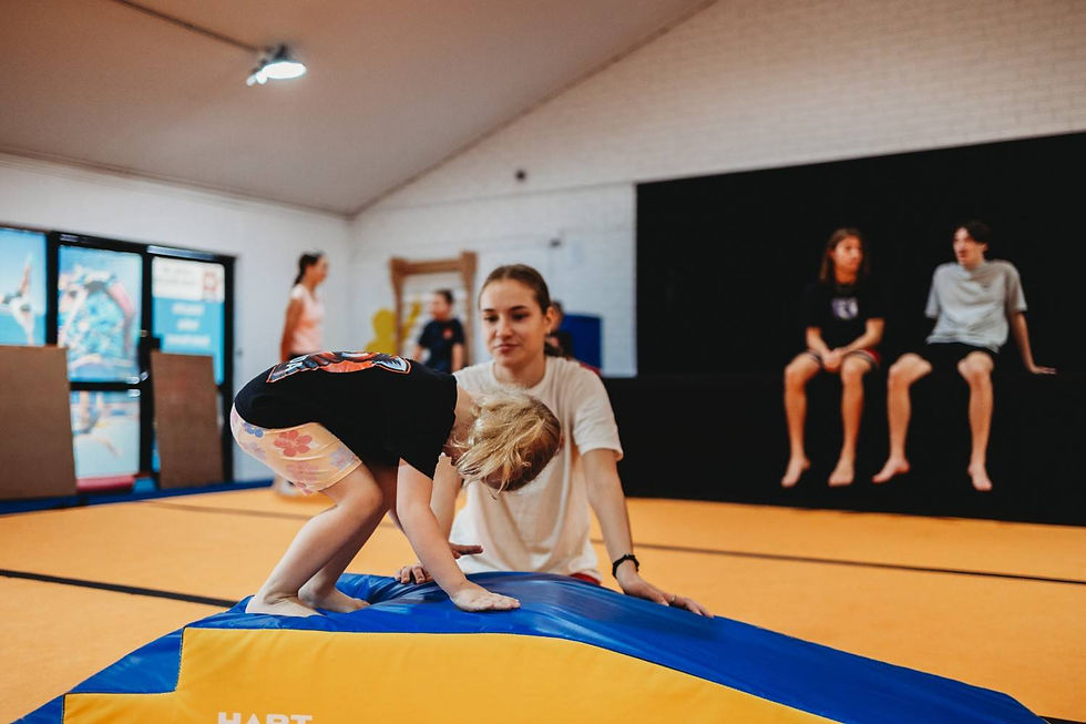 RPG Junior student tumbling with coach.jpg