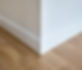 Detail of corner flooring with intricate crown molding and plinth_edited.jpg