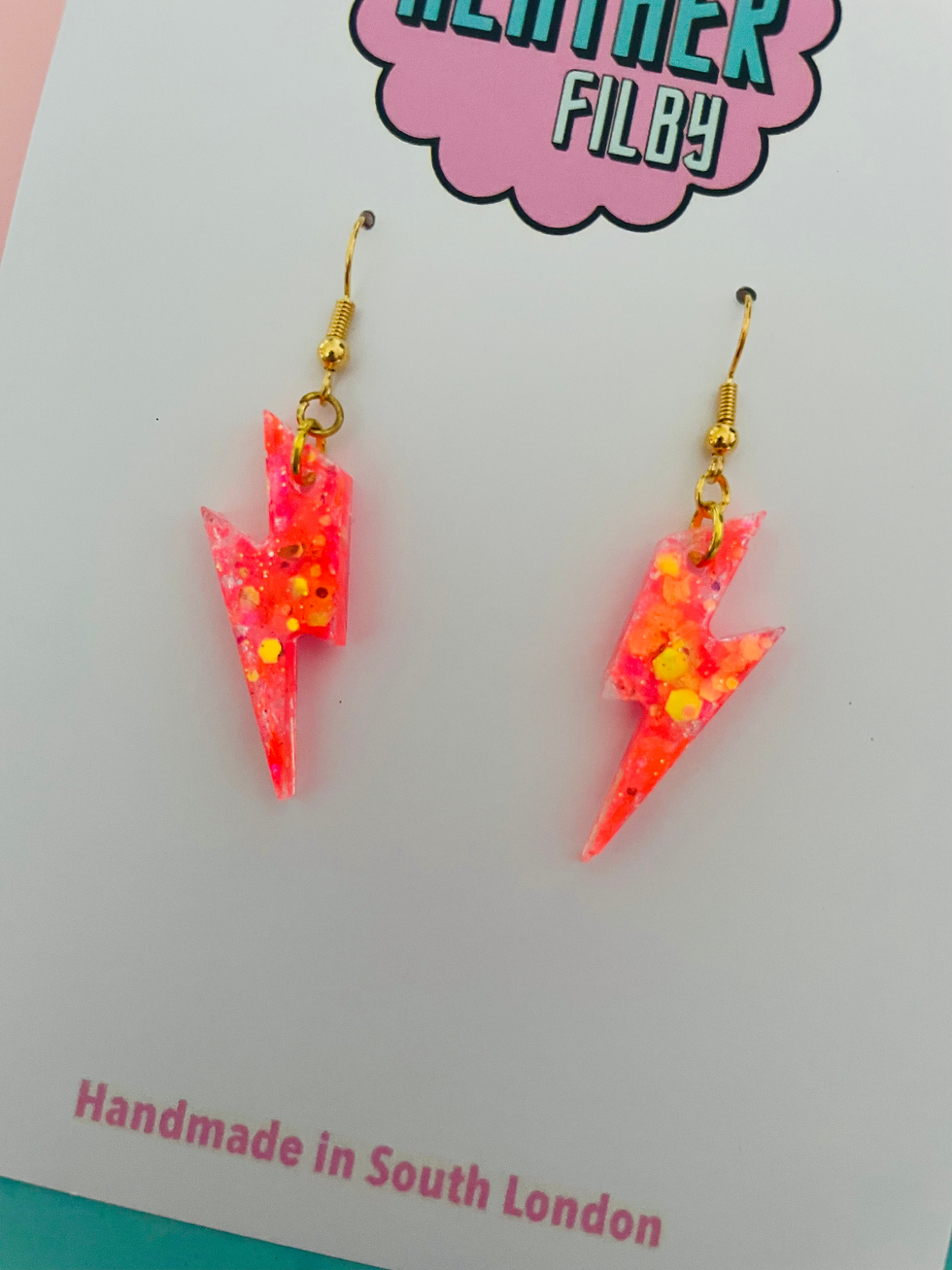 Mini neon orange glitter lightning bolt earrings
