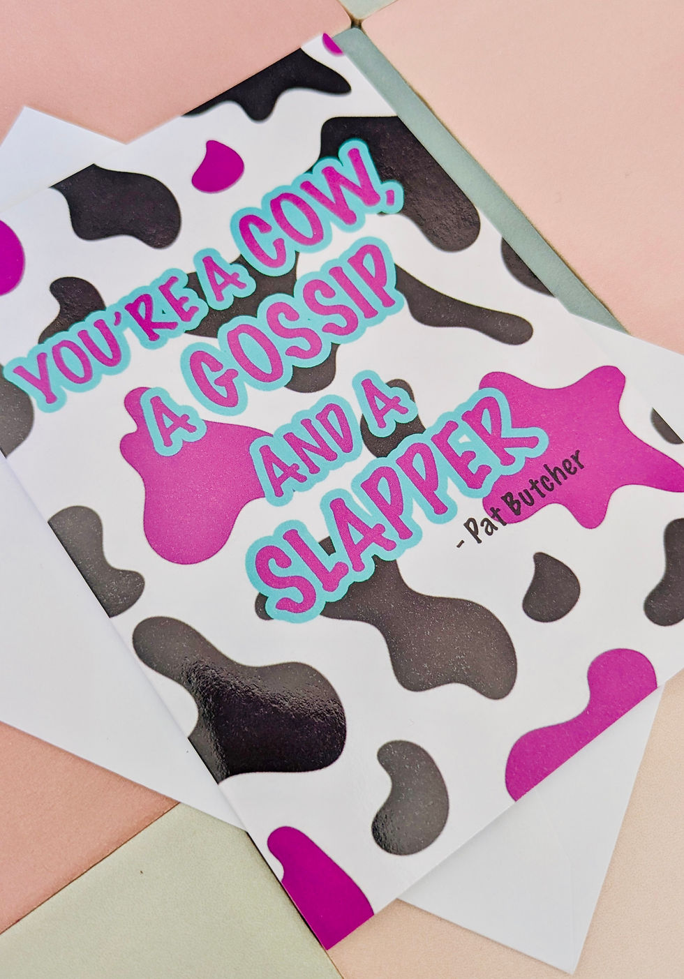 Thumbnail: Pat Butcher Quote Card – “You’re a Cow, a Gossip, and a Slapper” – Cow Print A5
