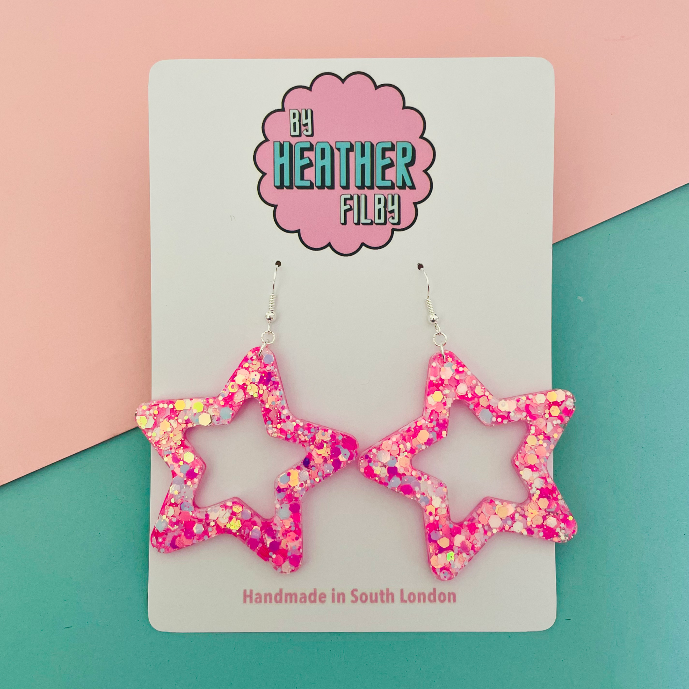 Large pink iridescent glitter star earrings