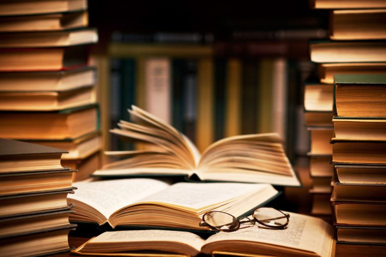 picture-of-a-stack-of-books-with-some-harry-potter-glasses-768x512.jpg