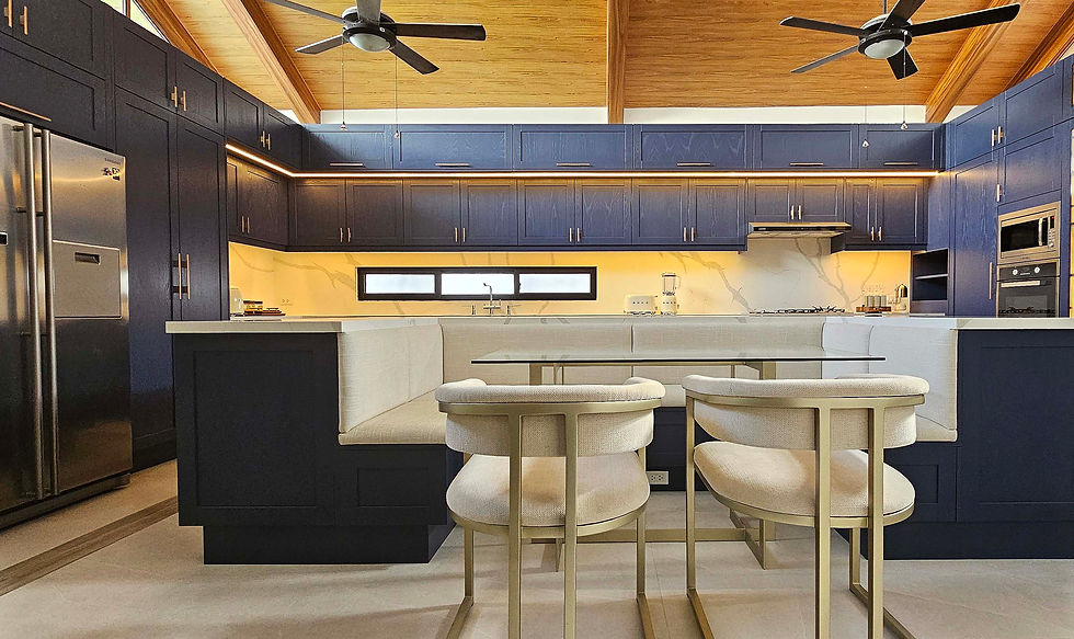 Solid wood doors in shaker design painted in blue, calacatta quarts, flutted glass